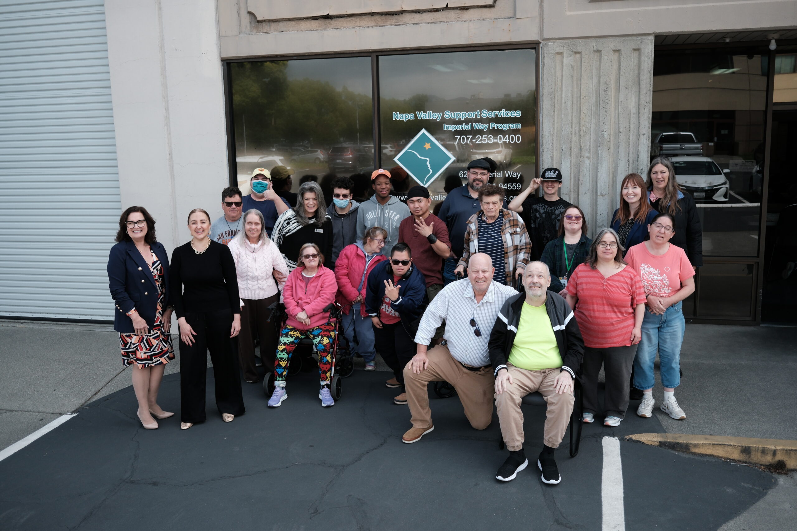 group of Napa Valley Support Services staff, supporters and beneficiaries in front of the Imperial Way Program office